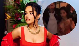 La acción viral de Becky G mientras posaba con hombre para una foto